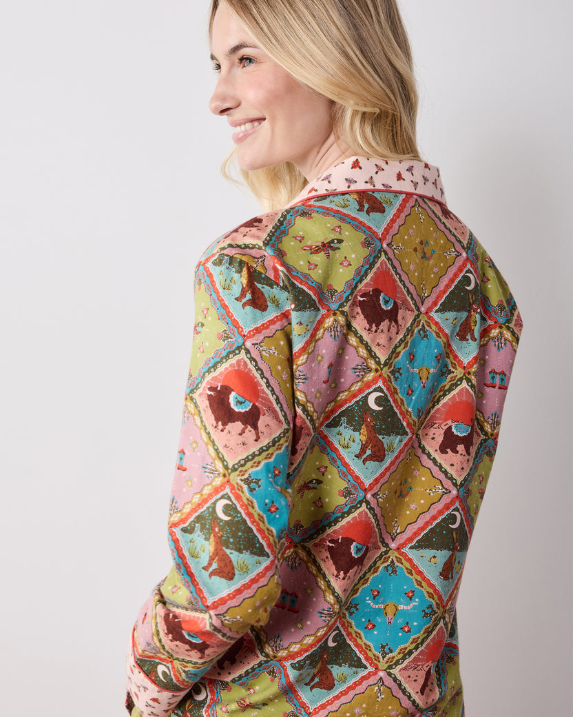 Back view of the olive Western Scenes long pajama set with a multicolored diamond print and contrasting patterned collar and cuffs.