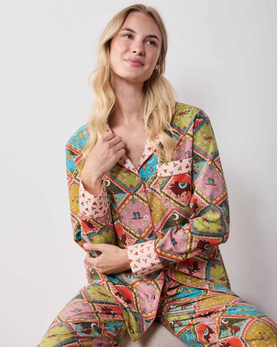 Front view of the olive Western Scenes petite long pajama set, showing the button-front top, chest pocket, contrasting collar and cuffs, and matching pants.