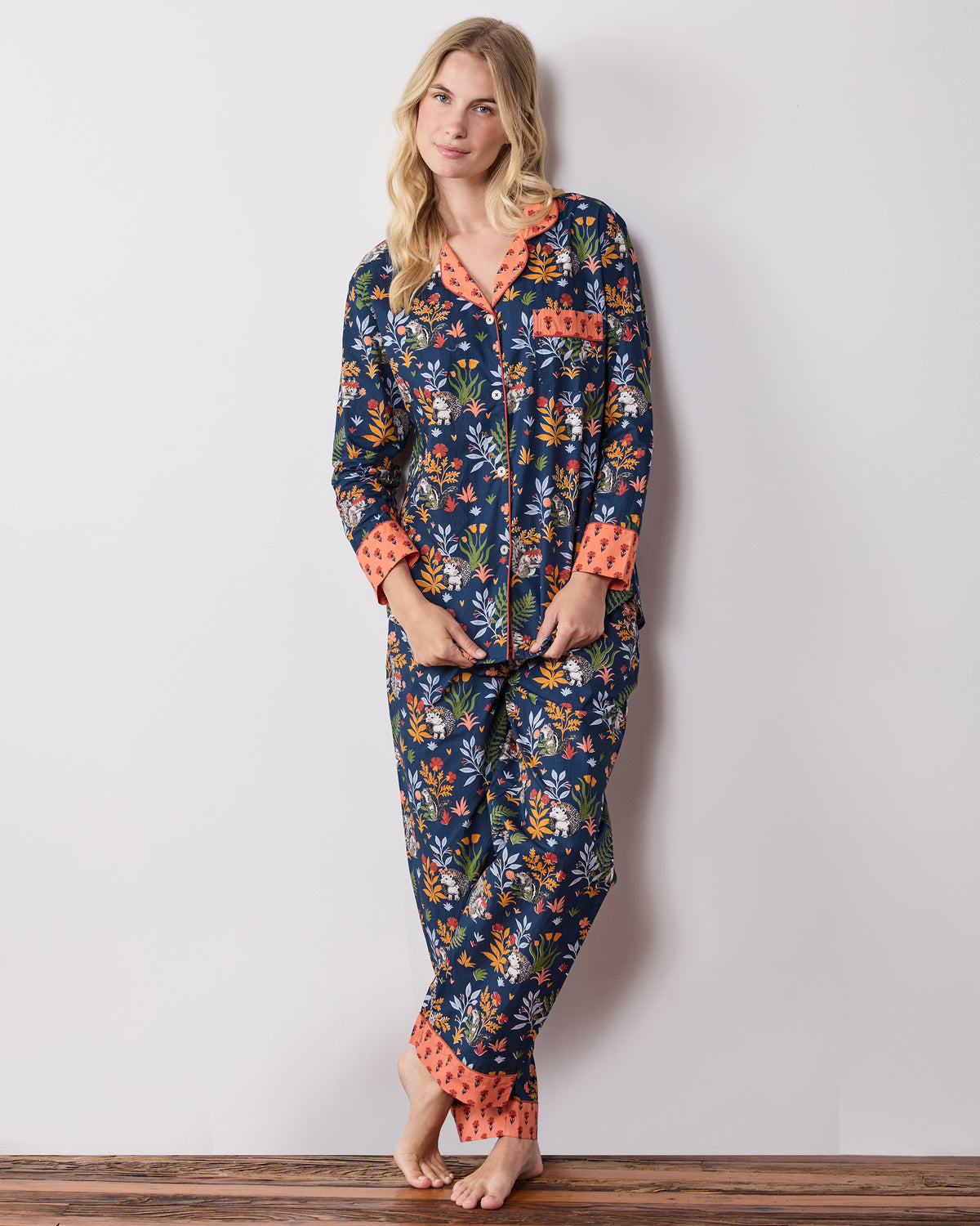 Front studio view of the Woodland Critters petite indigo long pajama set with a button-front top, pocket, and matching pants.