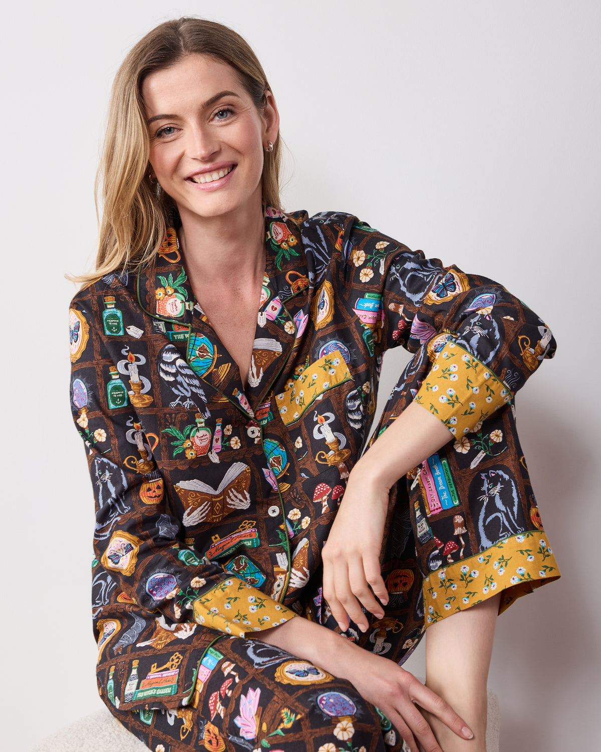 Front three-quarter view of the Enchanted Study tall long pajama set with a notched collar, button-down top, and full-length pants.