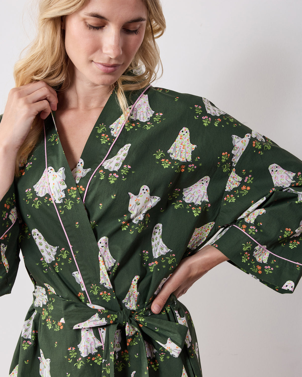 Close view of the Gardening Ghosts robe showing the notched collar, contrasting piping, ghost print, and tied waist.