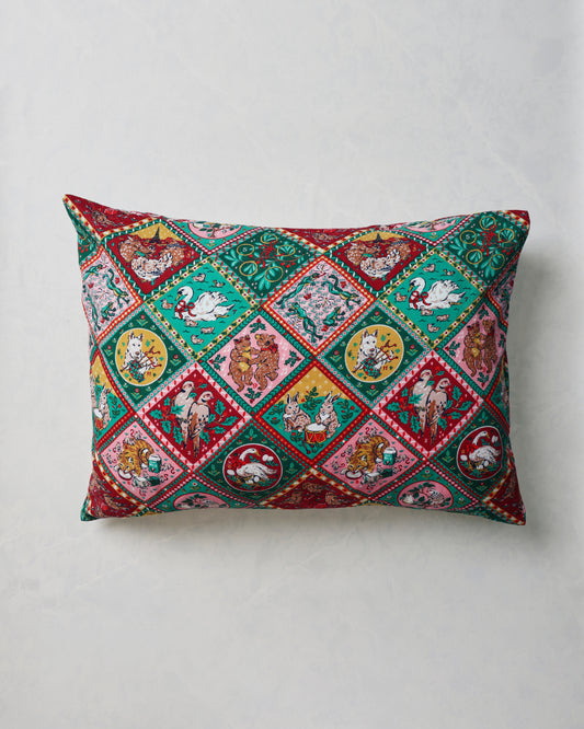 Rectangular pillowcase with a colorful repeating vintage holiday pattern of birds, animals, plants, and decorative borders.