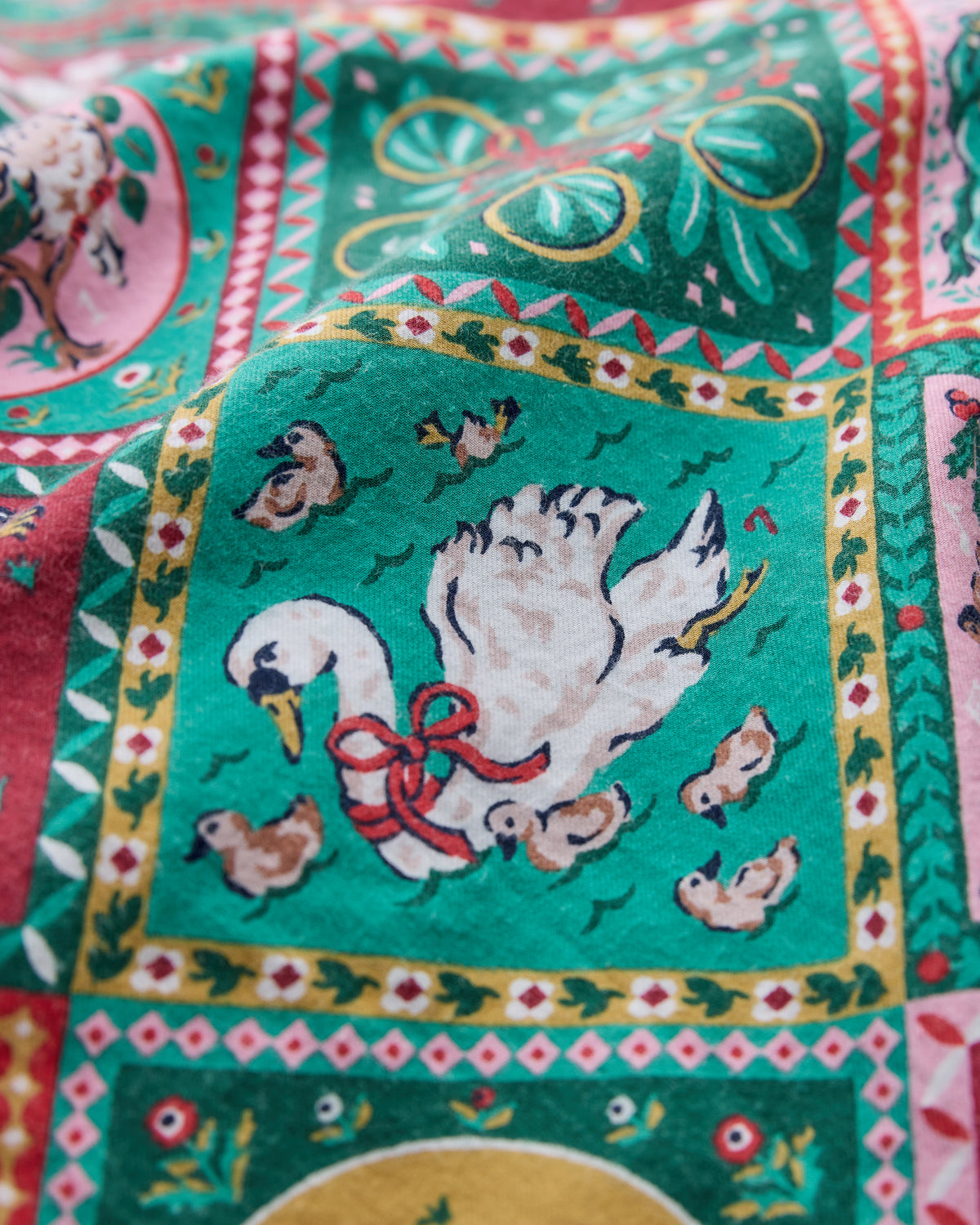 Close-up of the Vintage Holiday 12 Days of Christmas print, showing an illustrated white goose with chicks in a bordered green panel.
