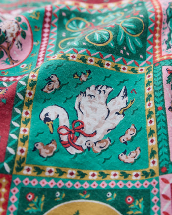 Close-up of the Vintage Holiday 12 Days of Christmas print, showing an illustrated white goose with chicks in a bordered green panel.