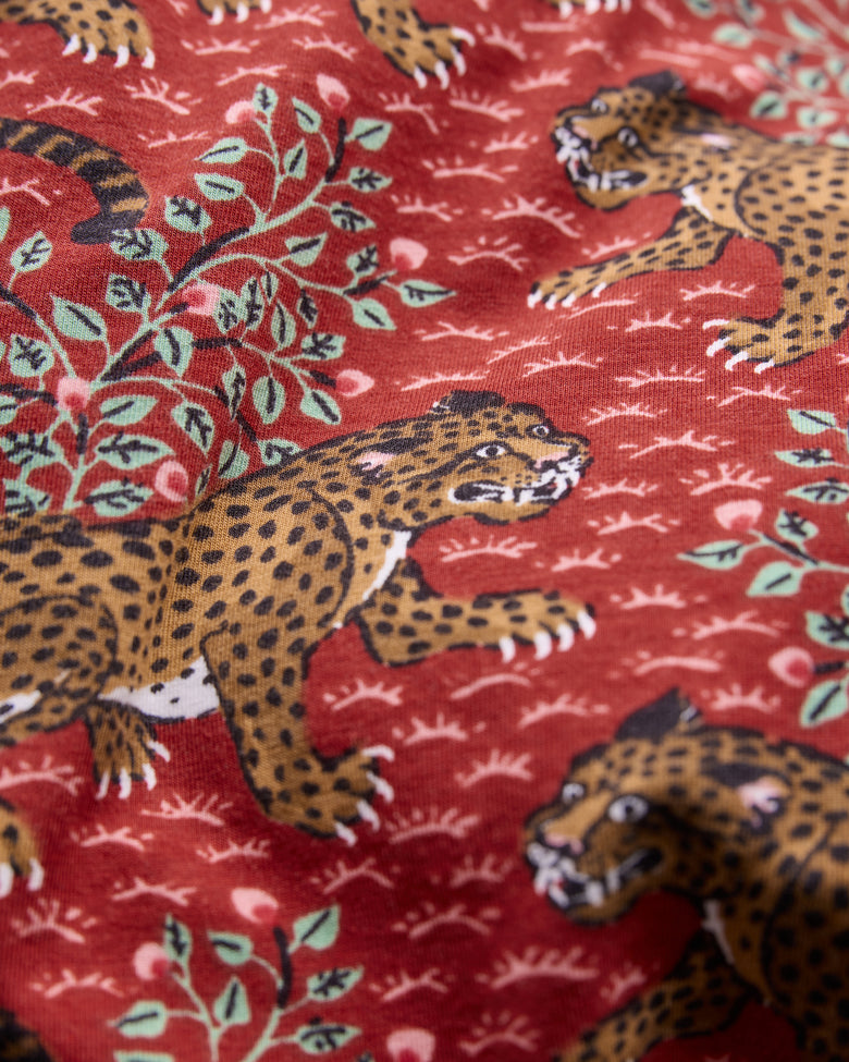 Close-up of the scarlet Bagheera print with spotted leopards and leafy branches