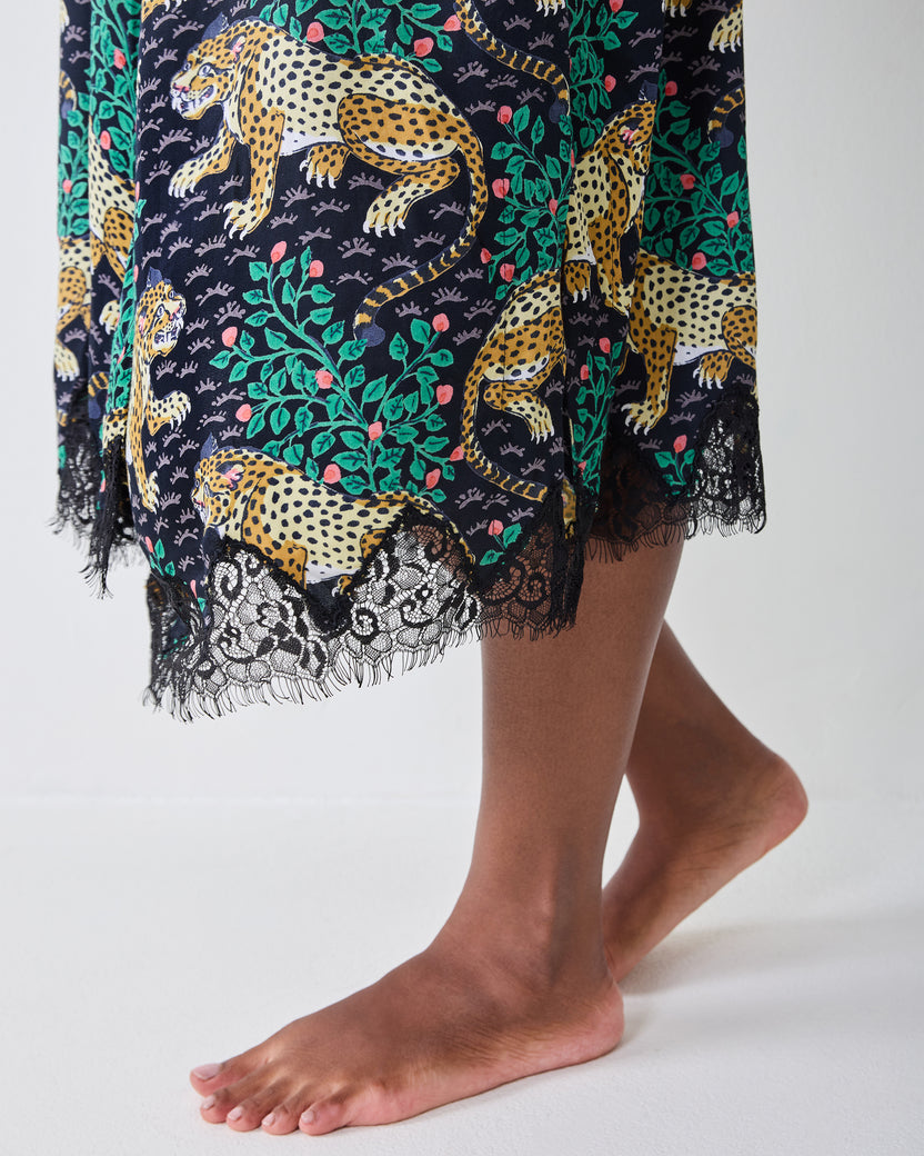 Close-up of the Bagheera Ink lace robe, showing the leopard-and-leaf print and black lace-trimmed hem.