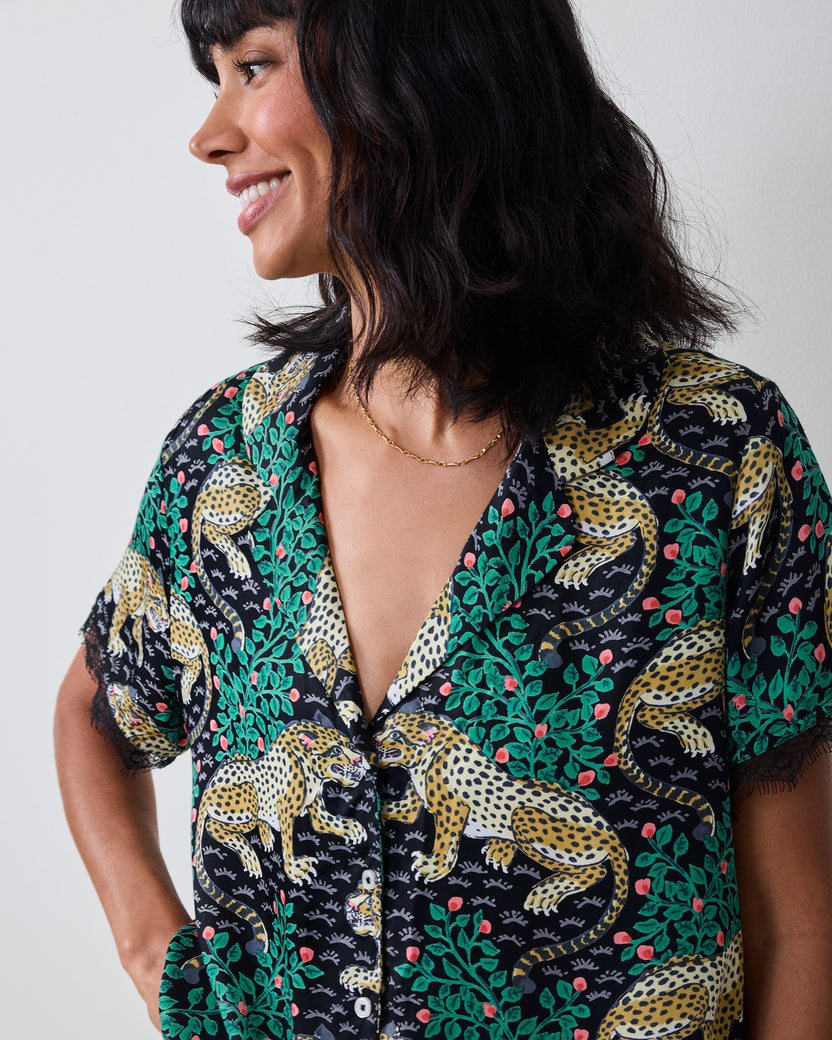 Close-up of the Bagheera Eco Satin Maryanne Set in Ink, showing the patterned button-front top, V-neckline, and lace-trimmed sleeves.