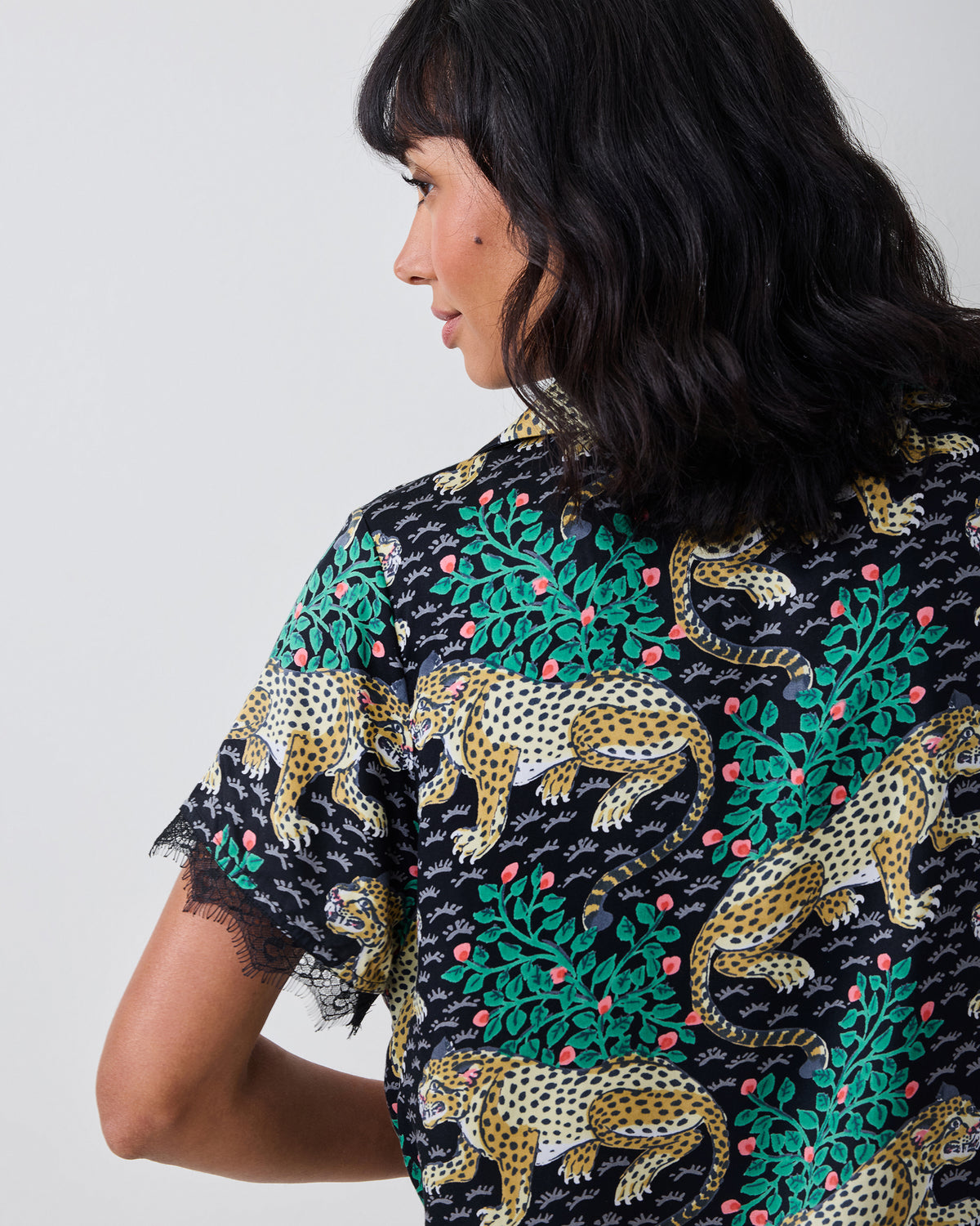 Close-up side view of the Bagheera Eco Satin Maryanne Set in Ink, showing the patterned short sleeve and back of the button-front top.