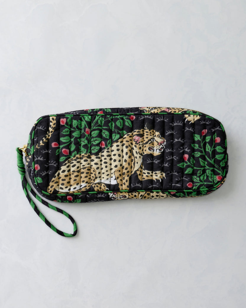 Bagheera Ink quilted zippered sunglasses case shown from the front with a leopard print panel and wrist loop.