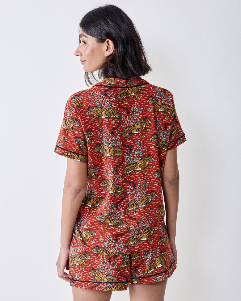 Back view of a person wearing the Scarlet Bagheera short pajama set, showing the printed short-sleeved top and matching shorts.