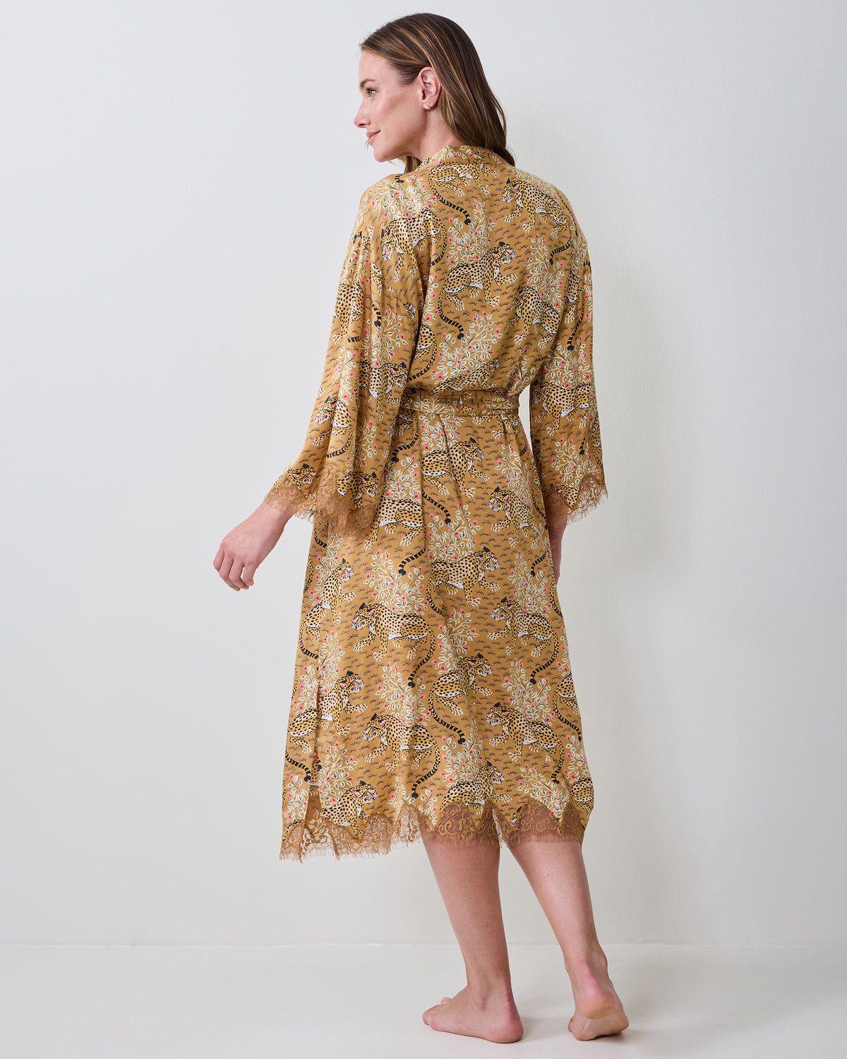 Bagheera tobacco lace robe shown from the back, tied at the waist with lace trim at the sleeves and hem.