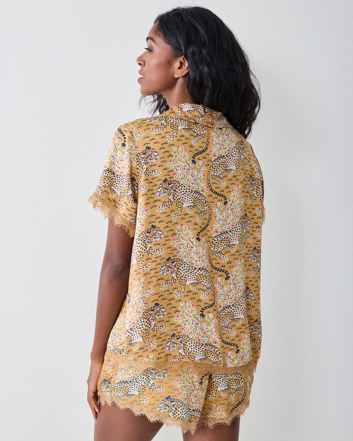 Back view of the tobacco Bagheera Maryanne set with a short-sleeved top and matching lace-trimmed shorts.
