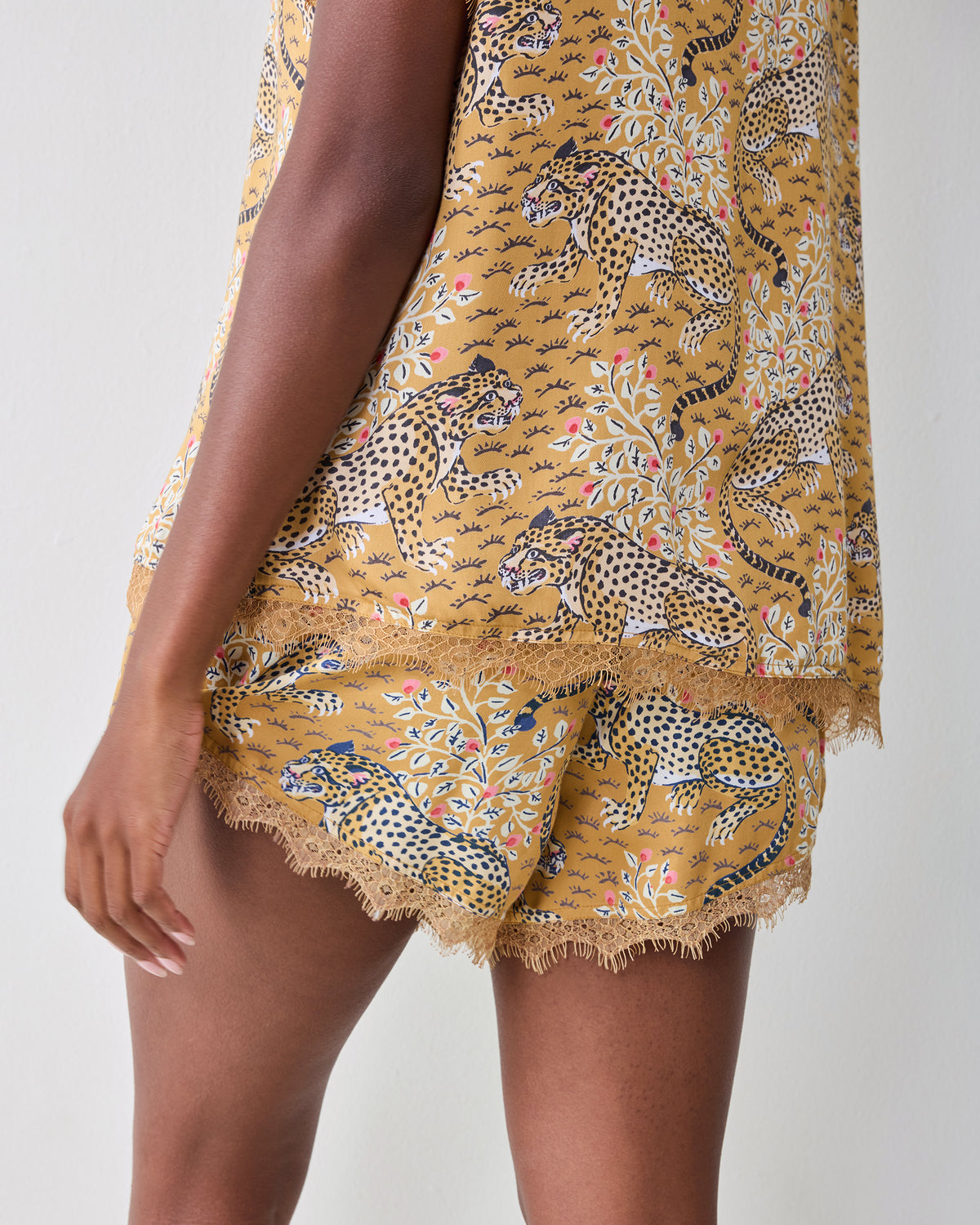 Close-up back view of the tobacco Bagheera Maryanne set showing the printed top and lace-trimmed shorts.