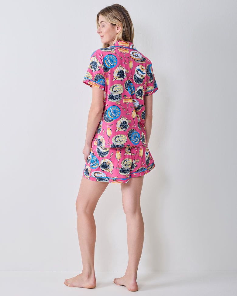 Back view of the hot pink Champagne & Caviar short pajama set with matching top and shorts.
