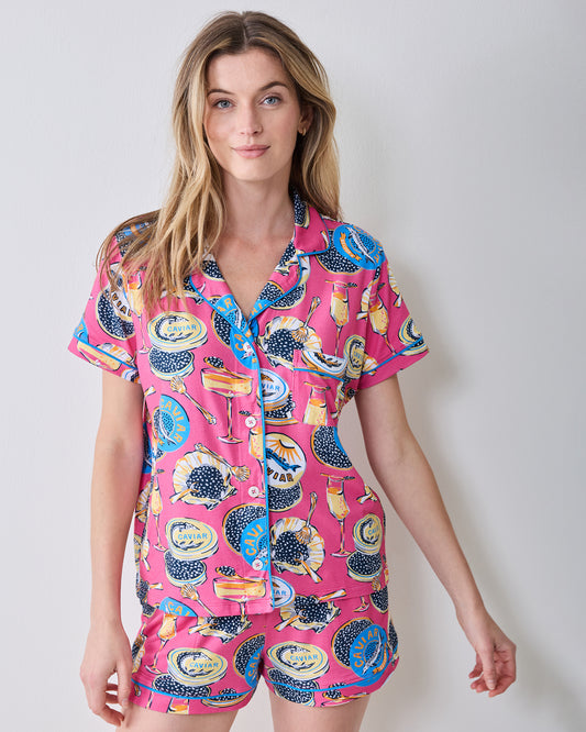 Front view of the hot pink Champagne & Caviar short pajama set with a button-front top and shorts.