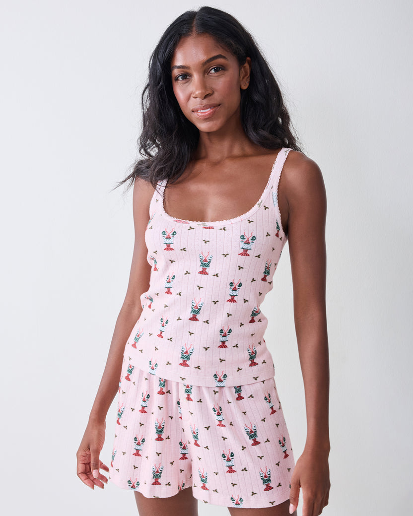 Front view of the Christmas Claws camisole and shorts pajama set with a repeating red, green, and white print.