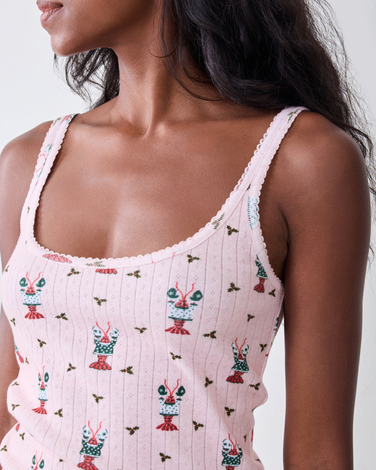 Close-up of the Christmas Claws camisole showing the scoop neckline, shoulder straps, and repeating crustacean print.