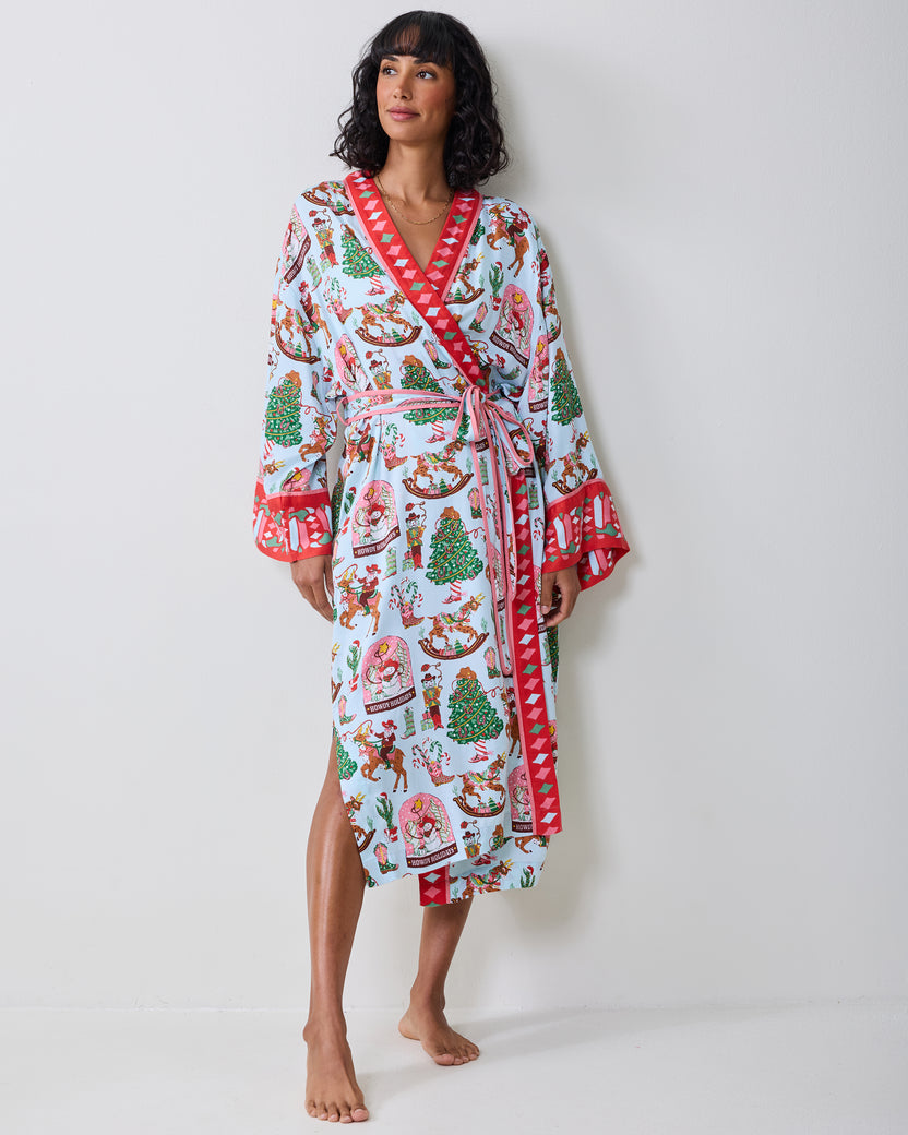 Front view of the pale blue Cowboy Christmas robe with a holiday print, red contrasting trim, tie belt, and long sleeves.