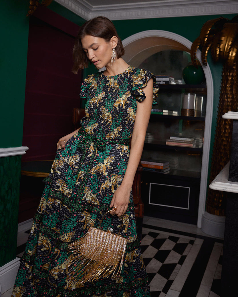 Ink Bagheera maxi dress with a leopard print, tiered ruffled skirt, short flutter sleeves, and a removable belt.