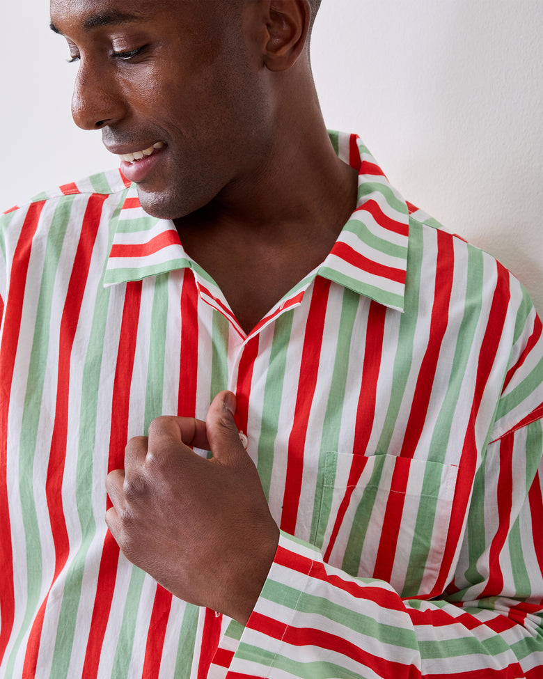 Close-up of the Elf Stripes sage and cherry pajama top showing the open collar, button front, chest pocket, and vertical stripes.