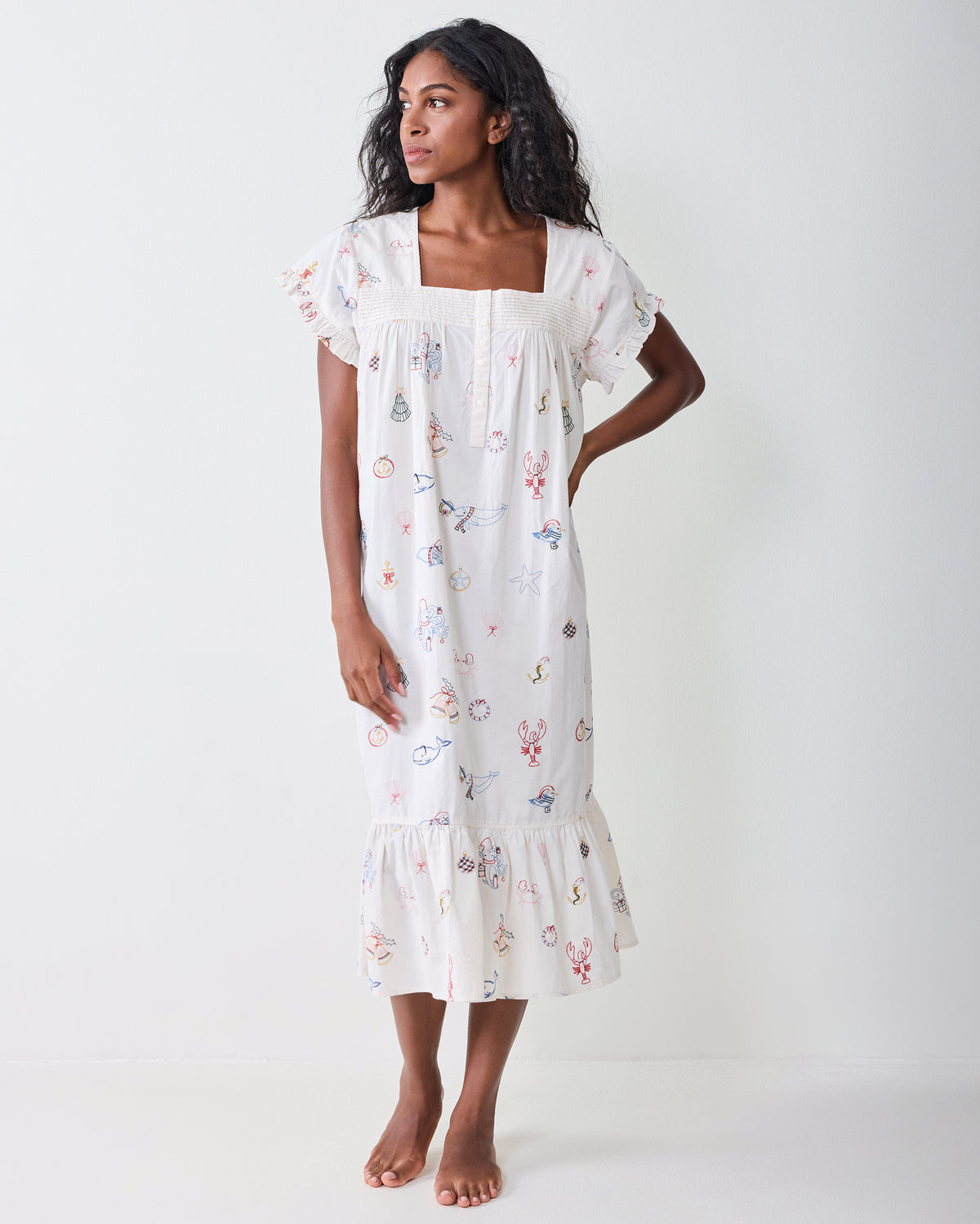 Front view of the Embroidered Yule Tides daylight nightgown with short ruffled sleeves and a lower ruffle.
