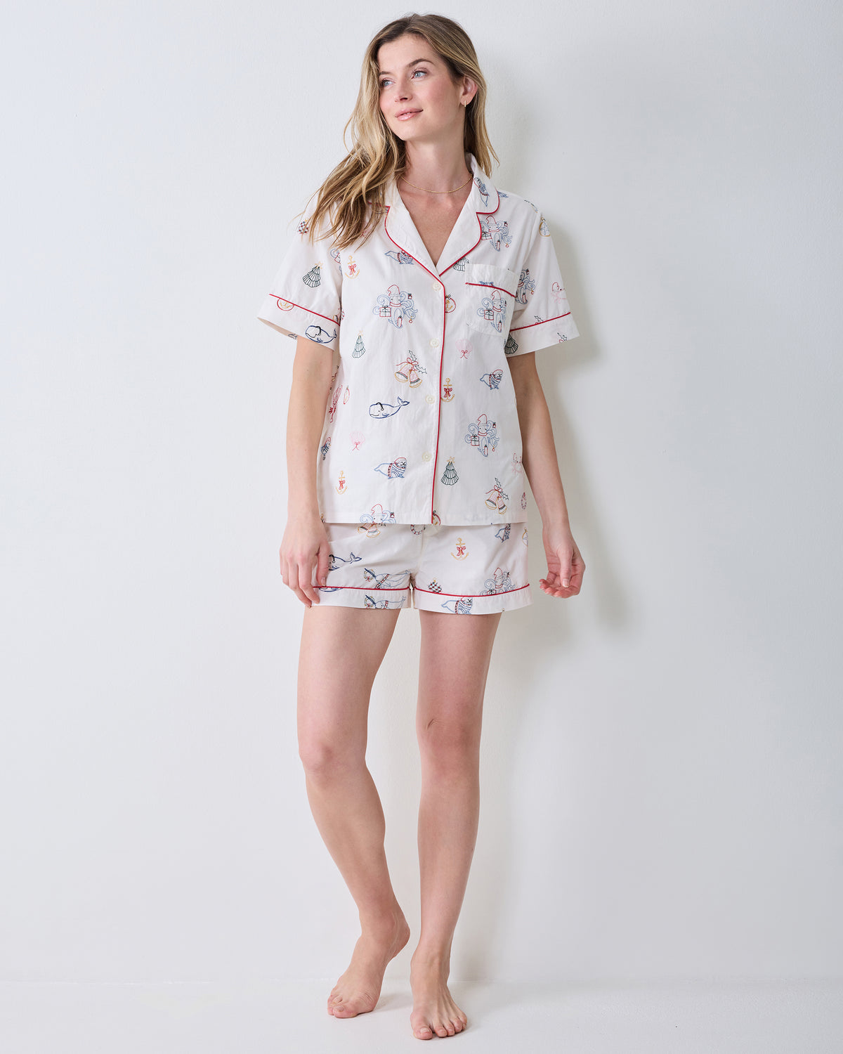 Full-length front view of the embroidered Yule Tides cloud Short PJ Set with a collared top and matching shorts.