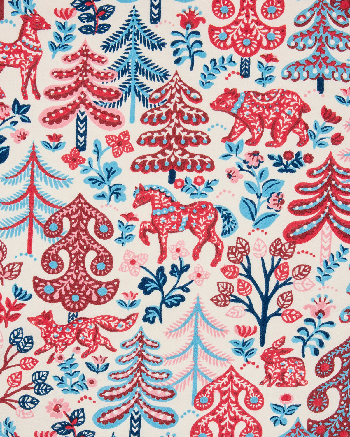Close-up of the Folklore Forest print with red and blue stylized trees, animals, flowers, and decorative motifs on a cream background.