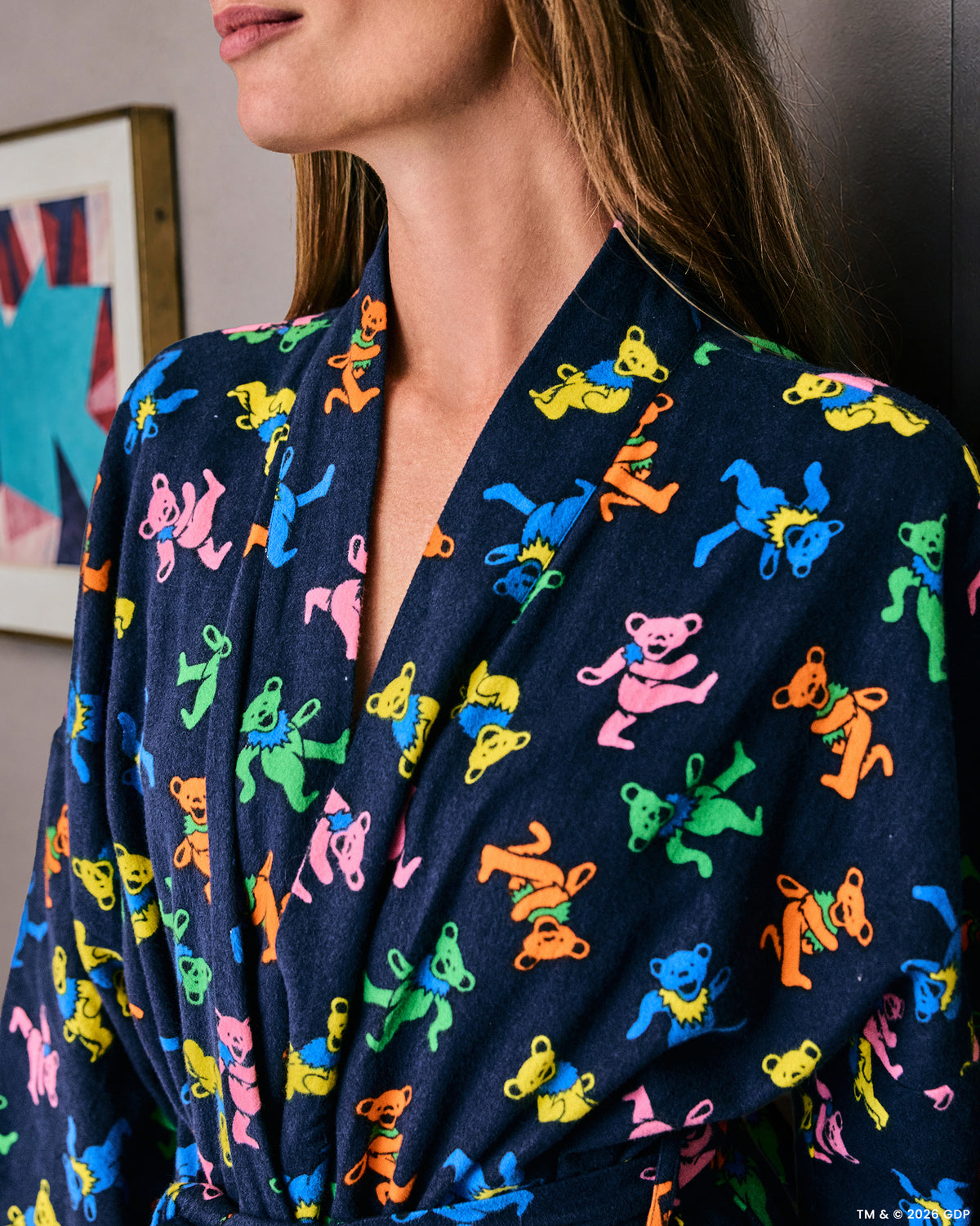 Close-up of the Dancing Bears long robe showing the printed shawl collar and colorful bear pattern.