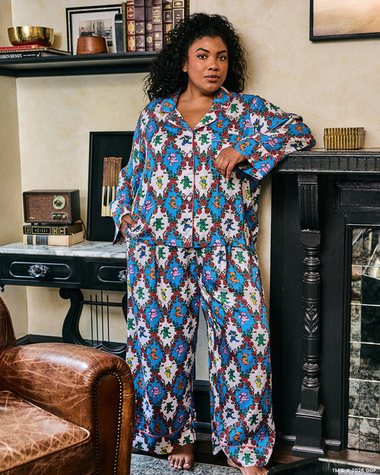 Full-length view of the Wandering Rose Palo Alto Soho set, showing a collared button-front top and wide-leg pants with a rose and dancing-bear print.