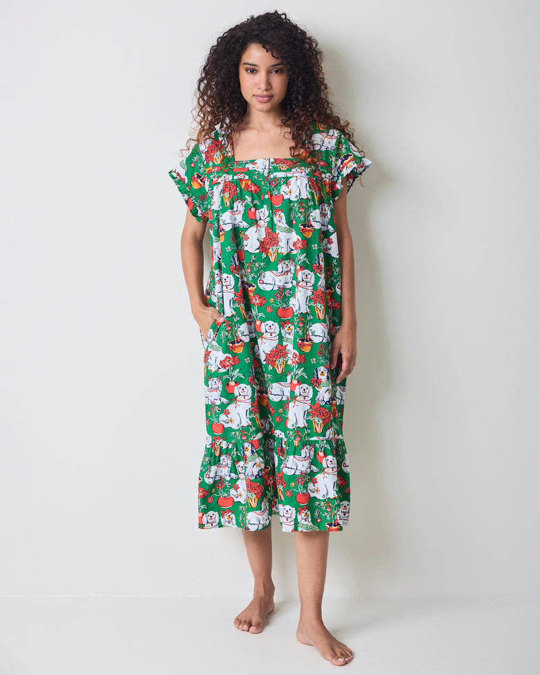 Front view of the green Good Dog Christmas nightgown with short ruffled sleeves, a button-front neckline, pockets, and an allover dog-and-poinsettia print.