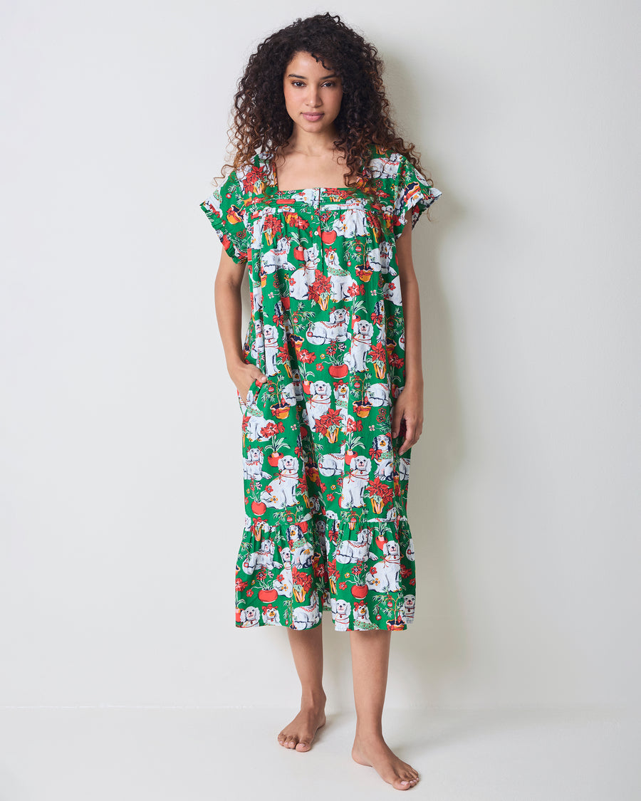 Front view of the green Good Dog Christmas nightgown with short ruffled sleeves, a button-front neckline, pockets, and an allover dog-and-poinsettia print.