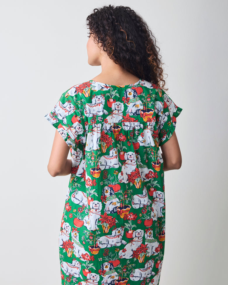 Back view of the green Good Dog Christmas nightgown showing the gathered yoke, short sleeves, and allover dog-and-poinsettia print.