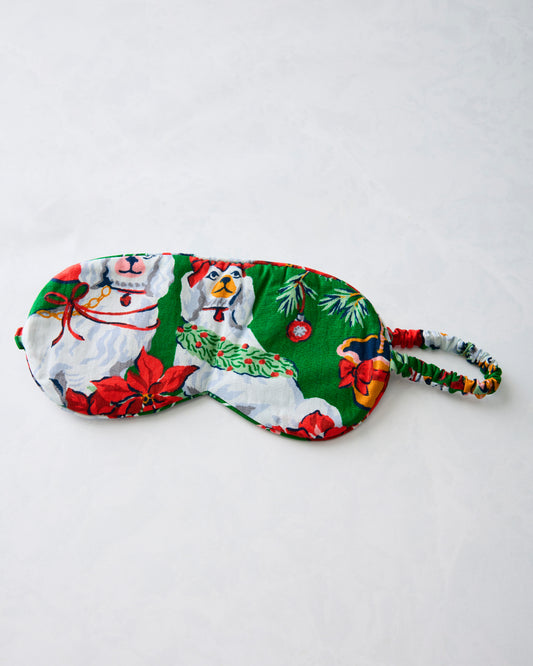 Green Good Dog Christmas eye mask with an adjustable printed strap, shown flat.