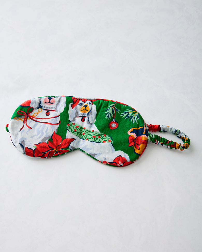 Green Good Dog Christmas eye mask with an adjustable printed strap, shown flat.