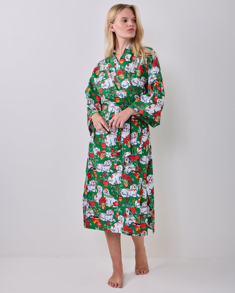 Full front view of a person wearing the green festive-print long robe with a matching belt.