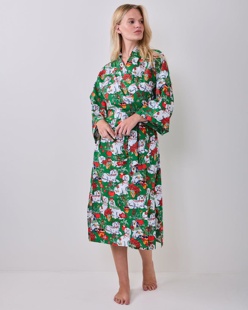 Full front view of a person wearing the green festive-print long robe with a matching belt.