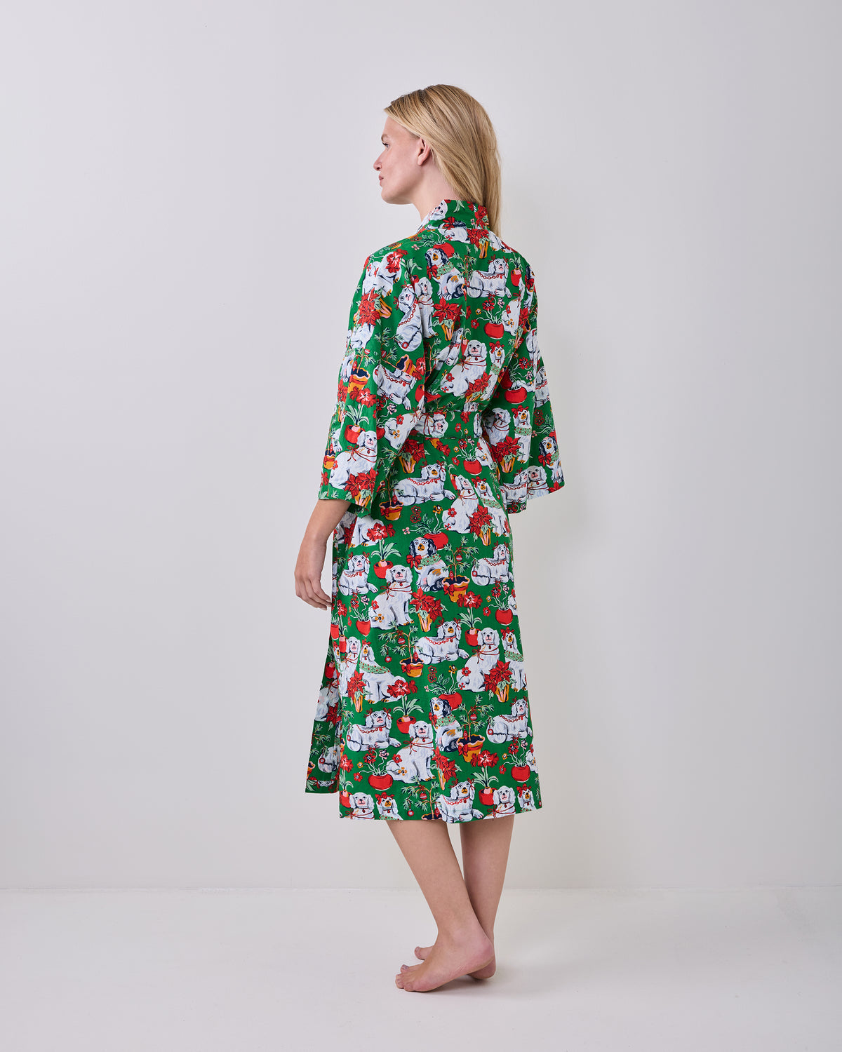 Back view of a person wearing the green printed long robe with a matching belt.