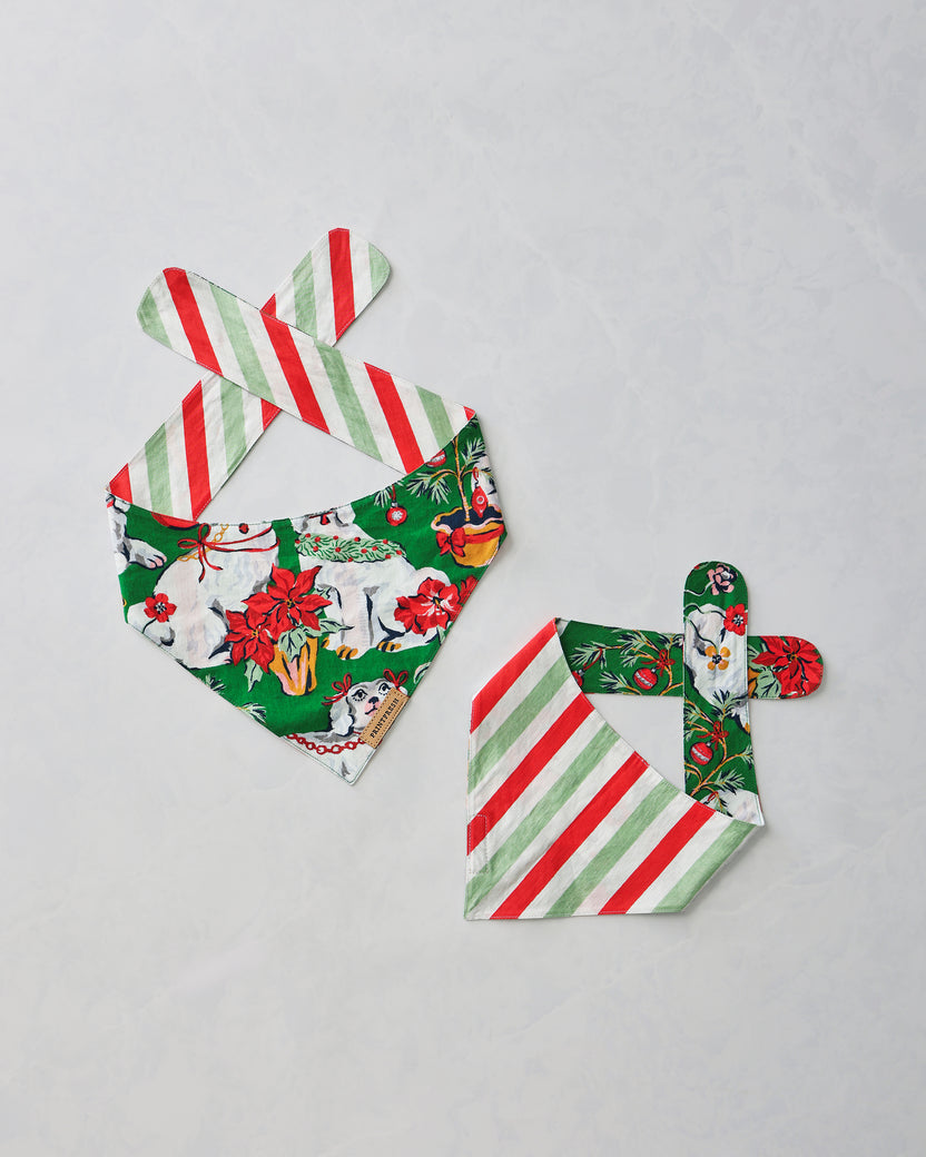 Two Good Dog Christmas pet bandanas displayed flat, showing the printed dog pattern and striped reverse side.
