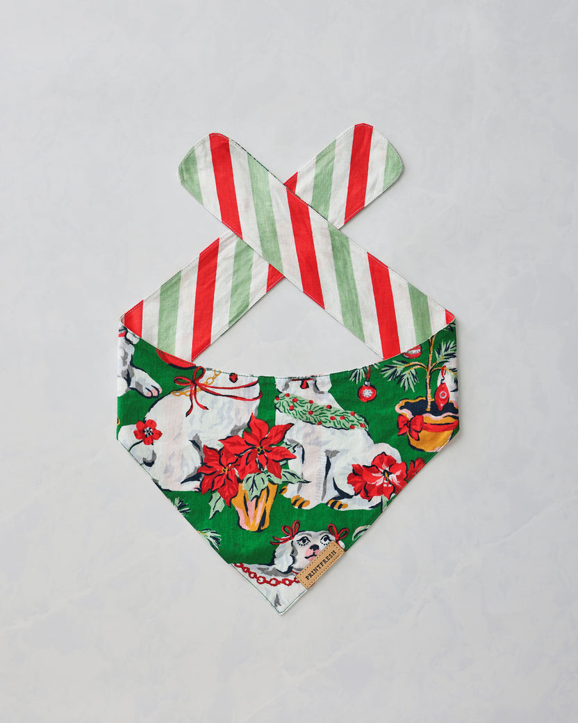 Good Dog Christmas pet bandana shown flat with the green dog-and-holiday print facing up.