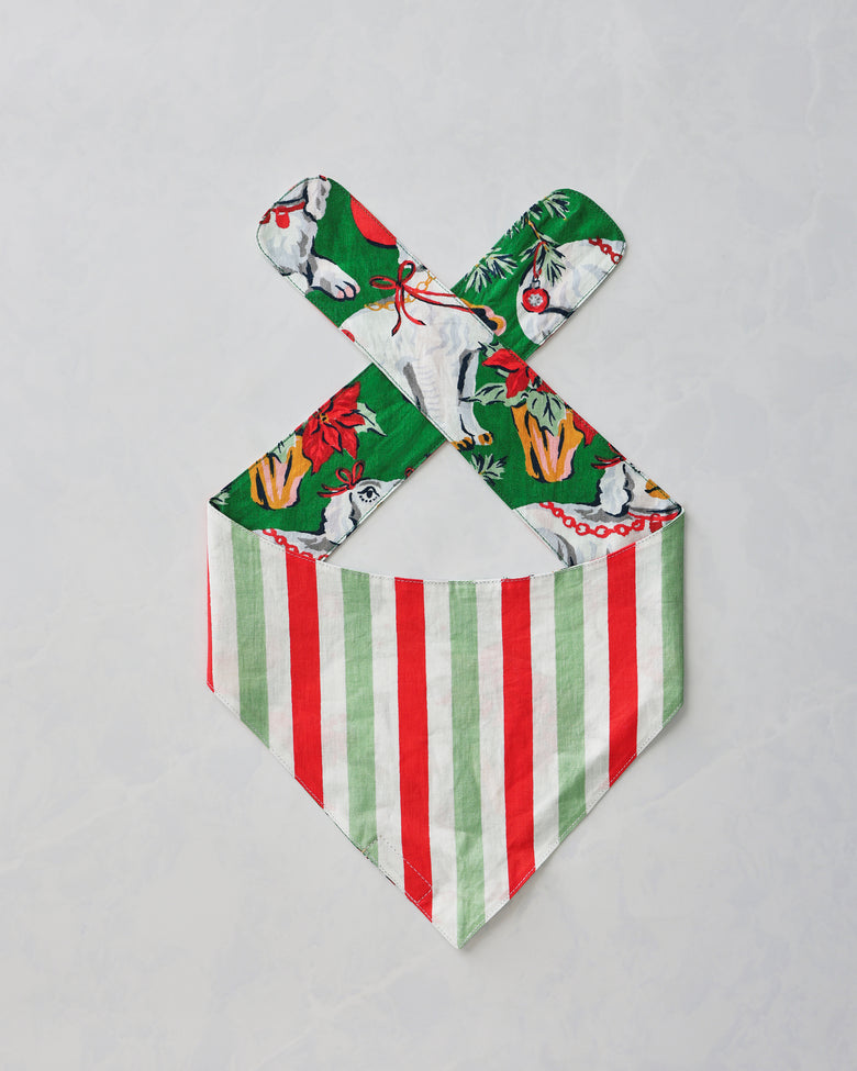 Good Dog Christmas pet bandana shown flat with the red, green, and white striped side facing up.