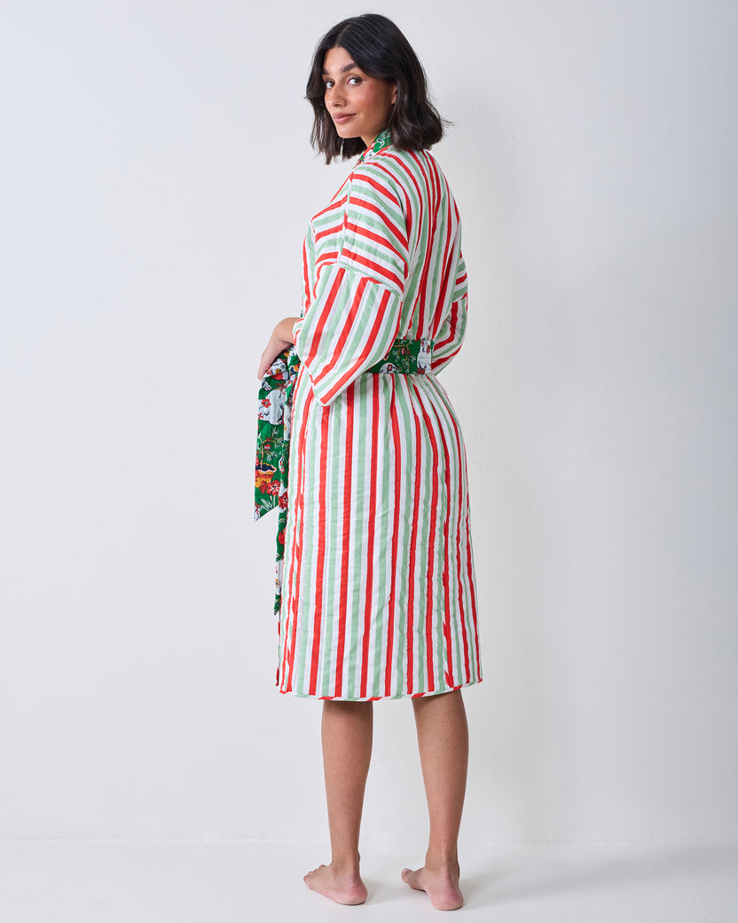 Back view of the Good Dog Christmas reversible quilted robe, showing vertical red, green, and white stripes, a matching belt, and a patterned lining at the sleeve and waist.