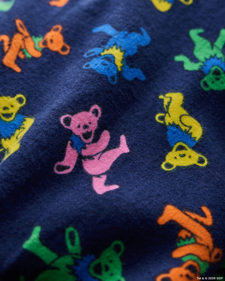 Close-up of the navy Dancing Bears fabric pattern with colorful bear figures.