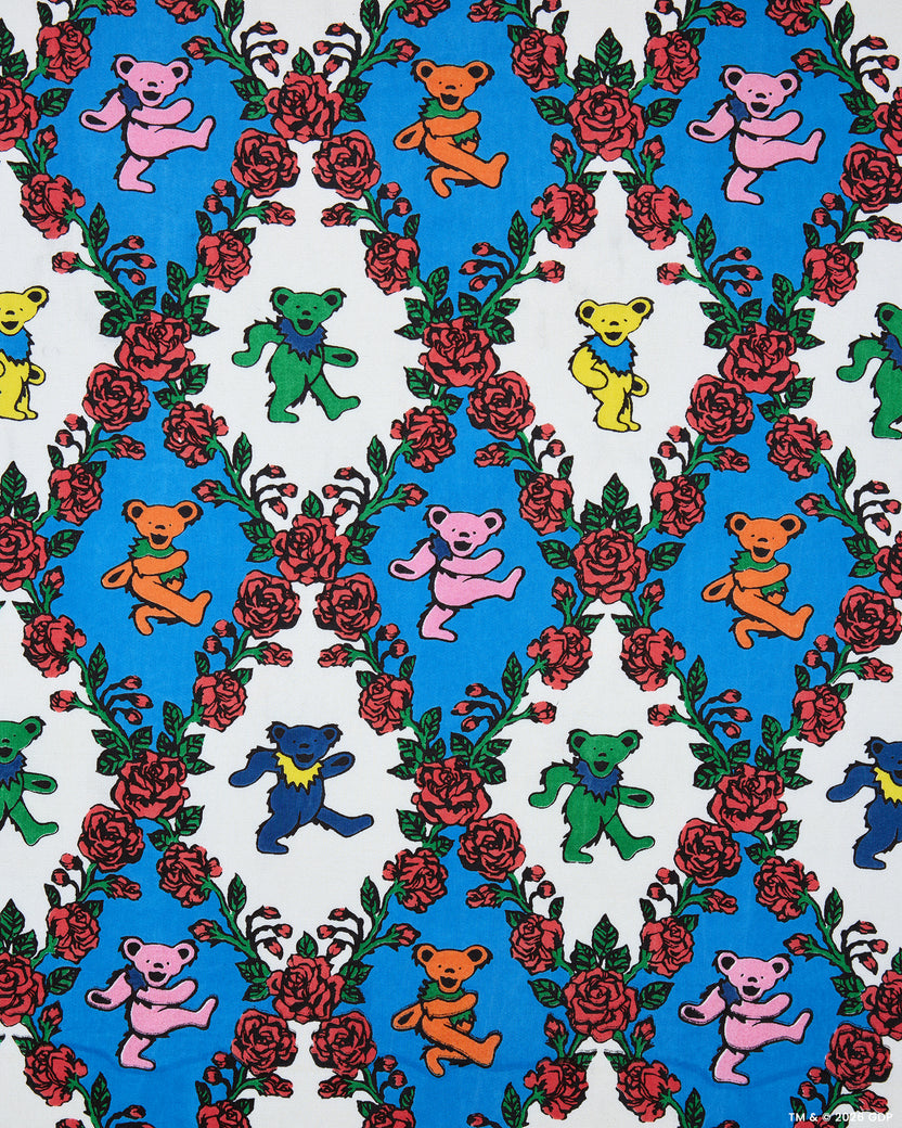 Wandering Rose print showing multicolored dancing bears among red roses on blue and white backgrounds.