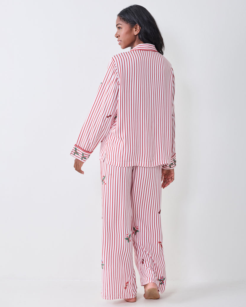 Back view of the red-and-white striped Ellie pajama set with embroidered motifs.