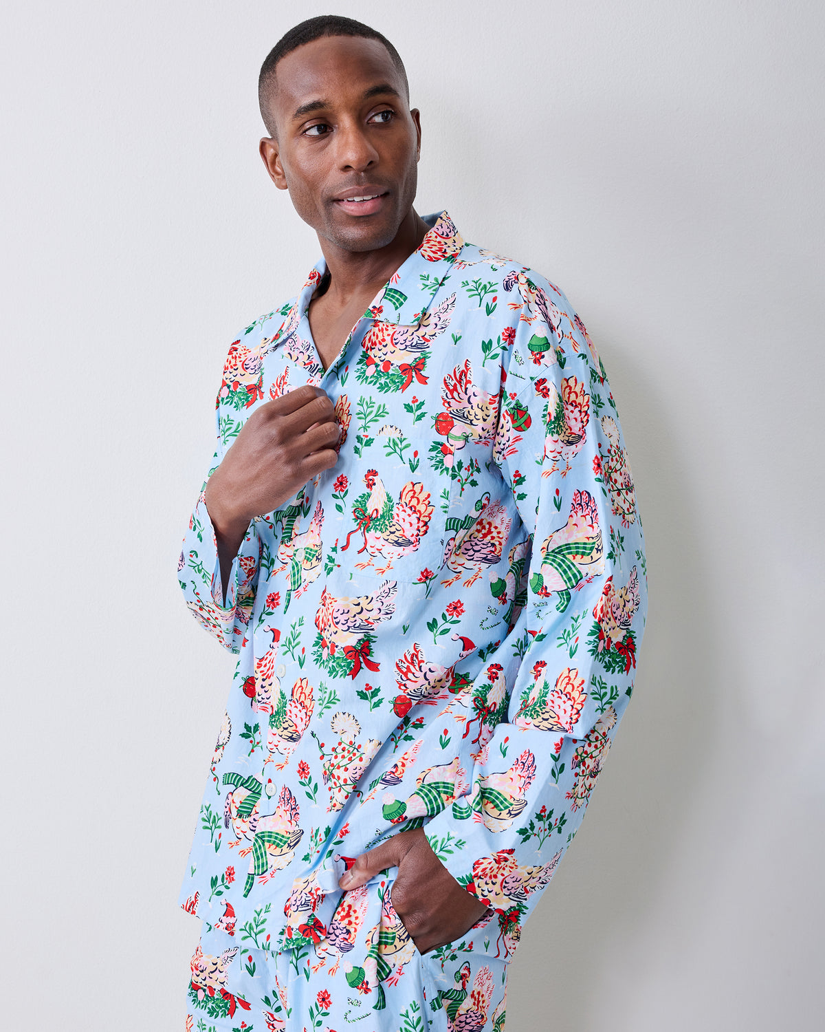 Person modeling a pale blue long-sleeve pajama shirt with a matching printed waistband and pants.