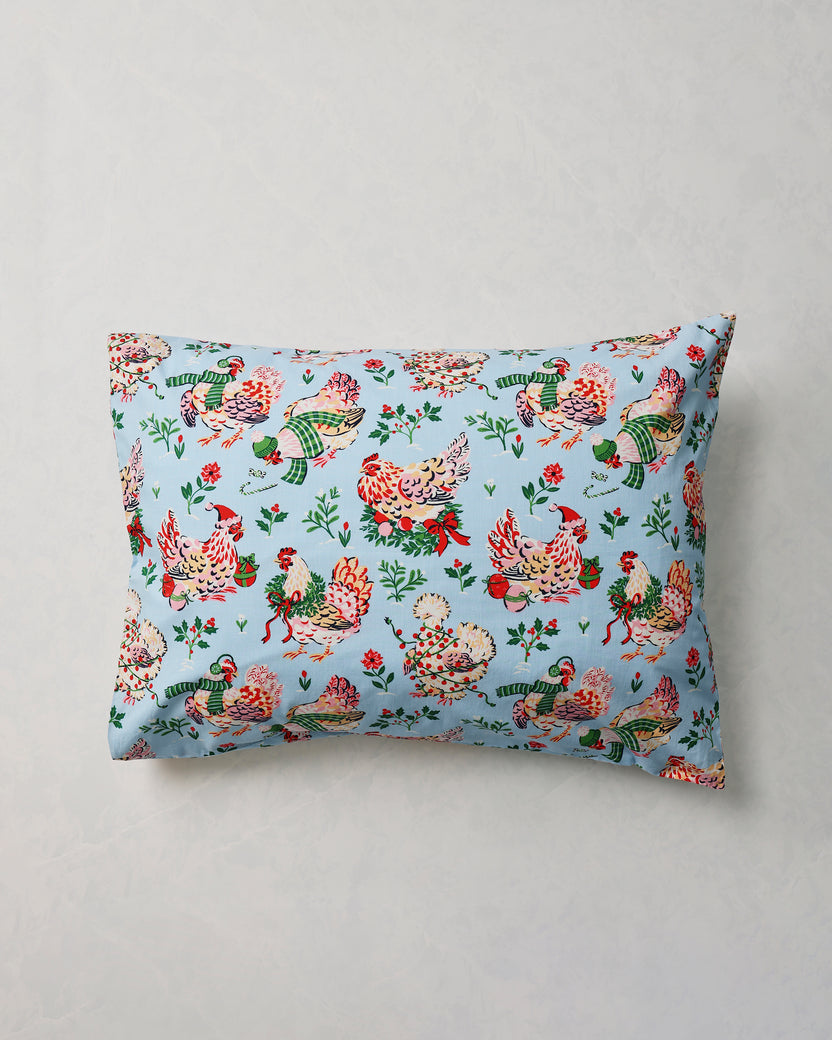 Single pale blue Holiday Hens pillowcase shown flat against a light background.