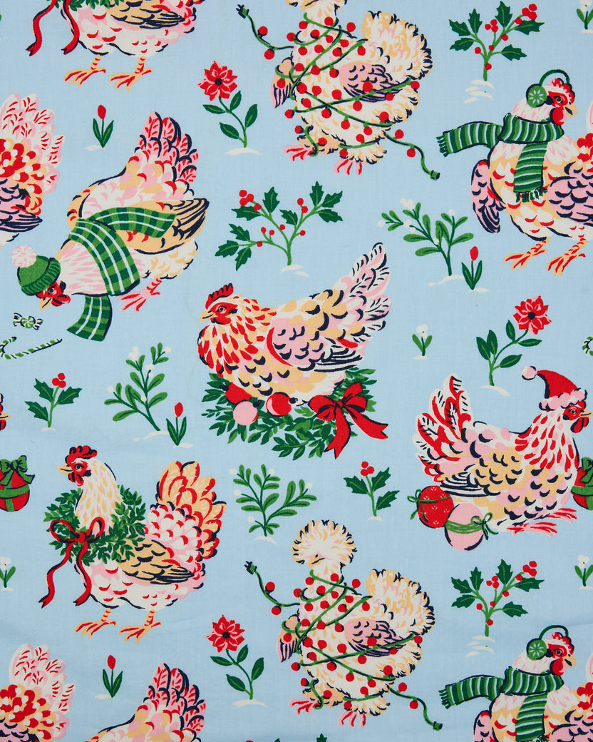 Pale blue Holiday Hens pajama print with illustrated hens, holly sprigs, flowers, and seasonal accessories.