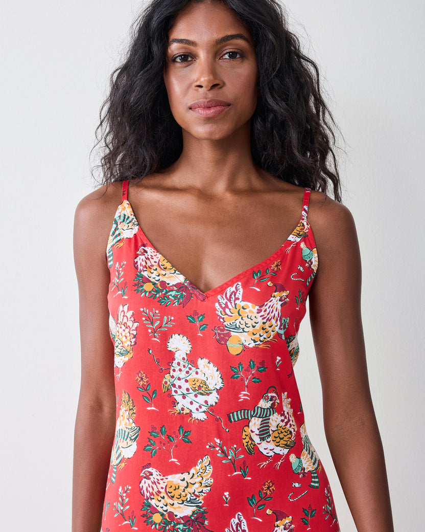 Close-up of the red Holiday Hens nightie showing its V-neckline, shoulder straps, and printed hen pattern.