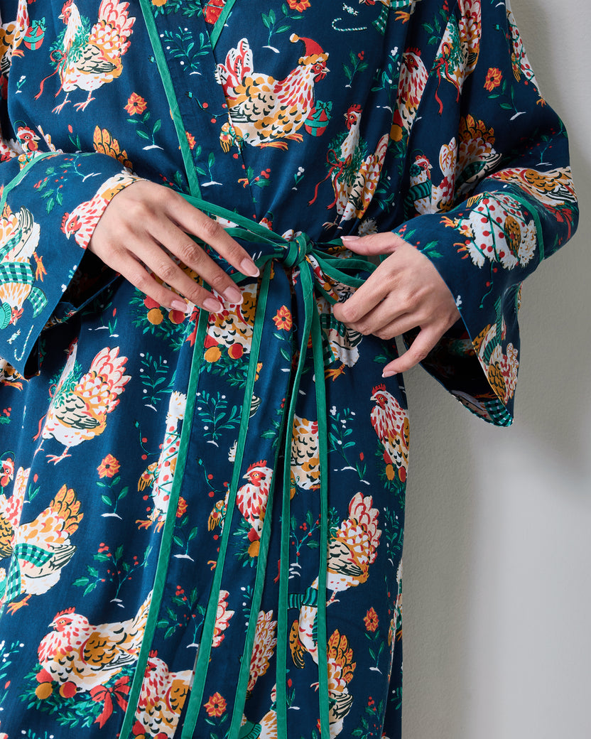 Close-up of the Holiday Hens robe showing the contrasting belt being tied over the chicken print.