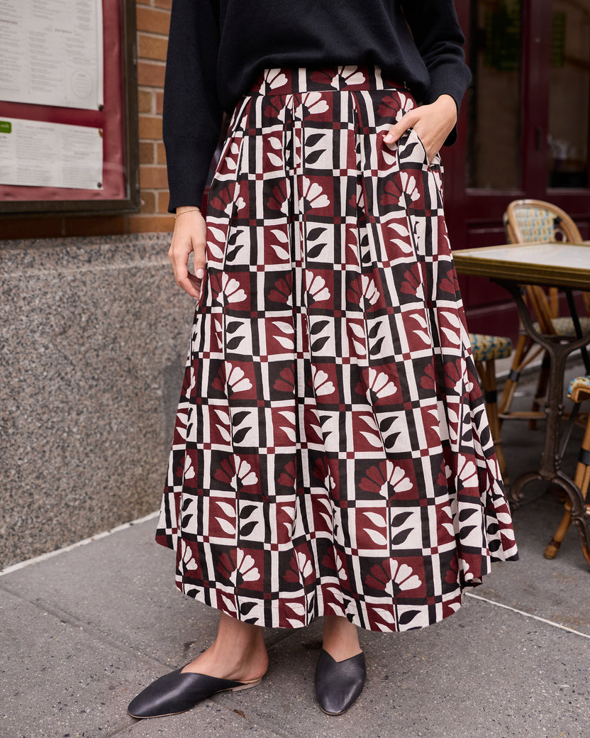 Close view of the Bordeaux Sparrow Skirt with a burgundy, cream, black, and white geometric floral print and side pockets.